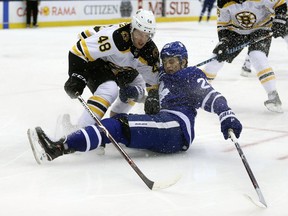 Boston Bruins' Matt Grzelcyk checks Toronto Maple Leafs' William Nylander during NHL action on Feb. 25, 2018 (JACK BOLAND/POSTMEDIA)