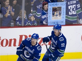 VANCOUVER . April 03 2018. Vancouver Canucks #22 Daniel Sedin and#33 Henrik Sedin during the pregame skate prior to playing the Vegas Golden Knights in a regular season NHL hockey game at Rogers Arena, Vancouver, April 03 2018.  Gerry Kahrmann  /  PNG staff photo)( For Prov / Sun Sports )  00052857A   [PNG Merlin Archive]