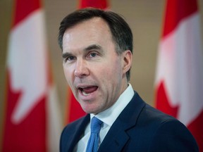 Finance Minister Bill Morneau speaks after touring the Brain Behaviour Laboratory at the University of British Columbia in Vancouver, B.C., on Tuesday, March 6, 2018. Regardless of what's going on behind the scenes, Morneau says the federal government isn't about to divulge how it plans to salvage the Trans Mountain pipeline expansion.