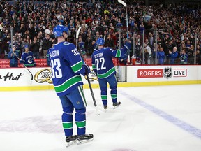Henrik and Daniel Sedin skate off the ice after their game against the Vegas Golden Knights at Rogers Arena on Tuesday night.