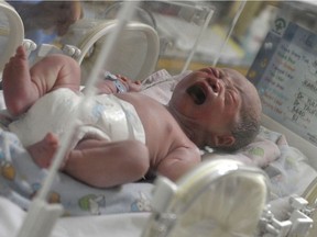 A newborn baby, one of 12 babies born by C-section, cries inside an incubator at the Bunda Hospital in Jakarta on December 12, 2012. Several hospitals in Indonesia's main cities performed more Caesarians than usual with new mothers hoping a 12-12-12 birth date will bring luck to their newborns.