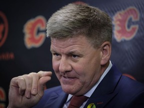 New Calgary Flames head coach Bill Peters gestures as he speaks to the media in Calgary on Monday, April 23, 2018.