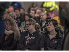 Community members listen during a press conference at the Elgar Petersen Arena in Humboldt, Sask., on Saturday, April 7, 2018. RCMP say 14 people are dead and 14 people were injured Friday after a truck collided with a bus carrying a junior hockey team to a playoff game in northeastern Saskatchewan.