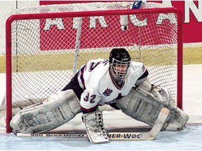 Latvia's goaltender Arturs Irbe concedes a goal during a game