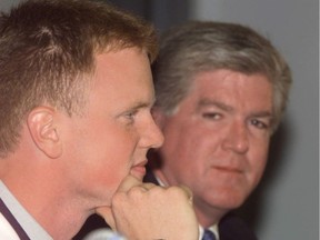 Brian Burke and Henrik Sedin at a 1999 press conference.