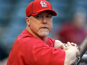 Coach Mark McGwire of the St. Louis Cardinals watches batting practice before a game against the Arizona Diamondbacks at Chase Field on April 19, 2010 in Phoenix. (Christian Petersen/Getty Images)