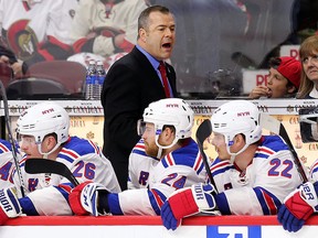 New York Rangers coach Alain Vigneault instructs the bench during a playoff game.