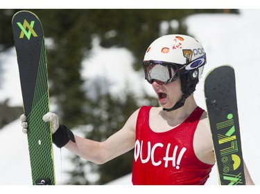 Vanya Rumyansev exits the pond after crashing into the water in the Grouse Mountain Slush Cup where competitors attempt to cross a pool of slush on their skis or board, North Vancouver  April 21 2018.