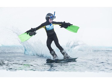 Jake Salomi participates in the Grouse Mountain Slush Cup where competitors attempt to cross a pool of slush on their skis or board, North Vancouver  April 21 2018.