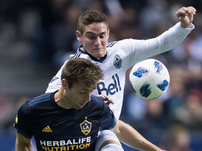 Jake Nerwinski of the Vancouver Whitecaps made life tough for Dave Romney of the Los Angeles Galaxy when the MLS teams played in Vancouver on March 24.