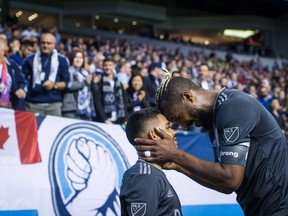 Vancouver Whitecaps' Cristian Techera, left, and Kendall Waston celebrate Techera's penalty kick goal against Real Salt Lake during second half MLS soccer action in Vancouver, B.C., on Friday April 27, 2018.