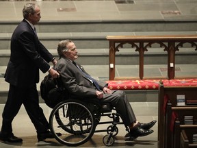 Former Presidents George W. Bush, left, and George H.W. Bush arrive at St. Martin's Episcopal Church for a funeral service for former first lady Barbara Bush, Saturday, April 21, 2018, in Houston.