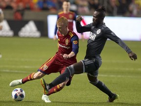 Defender Justen Glad of Real Salt Lake dribbles the ball against Vancouver Whitecaps' forward Kei Kamara during Saturday's MLS game at Rio Tinto Stadium in Sandy, Utah.