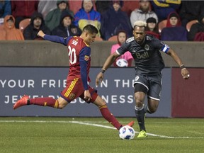 Real Salt Lake midfielder Luis Silva (20) shoots the ball against Vancouver Whitecaps defender Kendall Waston (4) during the first half Saturday at Rio Tinto Stadium.