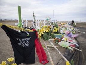 The memorial at the site of the Humboldt Broncos bus crash on April 6, 2018, is pictured four weeks later, on May 4. 2018. Sixteen people died as a result of the collision between the bus and a semi, and the other 13 onboard were all injured.