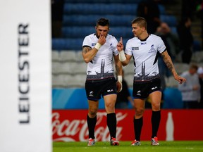 Florin Vlaicu and Valentin Calafeteanu celebrate following their team's victory during the 2015 Rugby World Cup Pool D match between Canada and Romania at Leicester City Stadium on October 6, 2015 in Leicester, United Kingdom. World Rugby announced Tuesday Romania has been disqualified from qualifying for the 2019 Rugby World Cup.