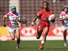 KITAKYUSHU, JAPAN - APRIL 22: Charity Williams of Canada makes a break during the 11-12th place match between Japan and Canada on day two of the HSBC Women's Rugby Sevens Kitakyushu at Mikuni World Stadium Kitakyushu on April 22, 2018 in Kitakyushu, Fukuoka, Japan.