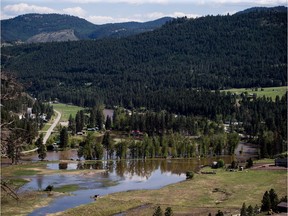 Flooded land is seen after the Kettle River overflowed its banks in Rock Creek, B.C., on Sunday May 13, 2018. The Regional District of Kootenay Boundary says about 3,000 residents remain on evacuation order due to the ongoing threat of a second flood, with high forecasted temperatures expected melt snow at higher elevations.