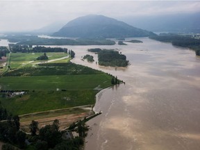 The swollen Fraser River is seen in an aerial view in Chilliwack on May 16, 2018. Advisories further upriver have been ended as the flood risk drops in some parts of B.C.