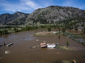 A home damaged by flood waters is seen in an aerial view, in Grand Forks, B.C., on Saturday May 12, 2018.