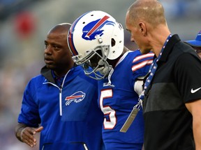 In this Aug. 26, 2017, file photo, Buffalo Bills quarterback Tyrod Taylor is assisted off the field after being sacked by Baltimore Ravens linebacker Matt Judon in the first half of a preseason NFL football game, in Baltimore