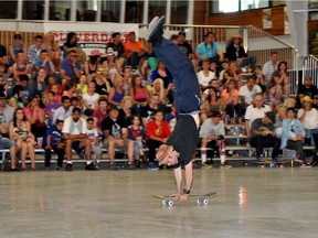 Darryl Grogan from Los Angeles does an English Handstand on his deck at a previous World Freestyle Round-Up.