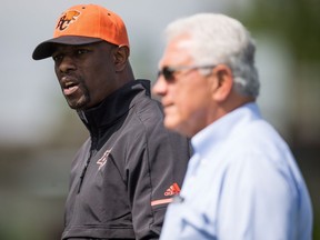 Ed Hervey, the new general manager of the B.C. Lions, chats with head coach Wally Buono during a recent team workout in Surrey.