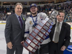 John Grisdale, who is stepping down as BCHL commissioner after this season, will ends his 15-year run at the RBC Cup in Chilliwack. He's shown here with Wenatchee captain A.J. Vanderbeck and BCHL executive director Trevor Alto at the Fred Page Cup this year in Wenatchee.