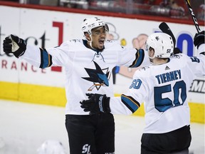 Evander Kane, an East Vancouver athlete who has found a permanent home with the NHL's San Jose Sharks, celebrates a goal with teammate Chris Tierney. Kane just inked a seven-year deal to stick in California.