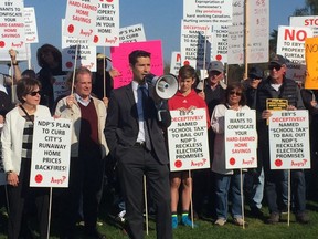 NPA mayoral candidate Glen Chernen leads a rally at Trimble Park Tuesday to protest against the provincial government's higher school taxes on homes over $3 million. The protest had been planned for a constituency meeting that was cancelled by David Eby, the MLA for Vancouver-Point Grey.