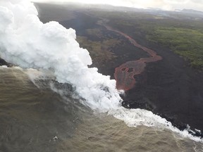 This image released by the US Geological Survey on May 22, 2018 shows by the end of the afternoon, only a single ocean entry that was active as the lava channel originates from fissure 22, during a late afternoon overflight of the lower East Rift Zone of K?lauea Volcano on May 21, 2018. Authorities in Hawaii have warned of dangerous "laze" fumes as molten lava from the erupting Kilauea volcano reached the Pacific Ocean. Two lava flows "reached the ocean along the southeast Puna coast overnight," on Hawaii's Big Island, the US Geological Survey, which monitors volcanoes and earthquakes worldwide, said in a statement May 20, 2018. / AFP PHOTO / US Geological Survey / HO / RESTRICTED TO EDITORIAL USE - MANDATORY CREDIT "AFP PHOTO / US Geological Survey/HO" - NO MARKETING NO ADVERTISING CAMPAIGNS - DISTRIBUTED AS A SERVICE TO CLIENTS HO/AFP/Getty Images