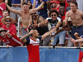 FC Dallas forward Maximiliano Urruti simulates shooting an arrow after scoring a goal against the Vancouver Whitecaps in Frisco, Texas on Saturday.