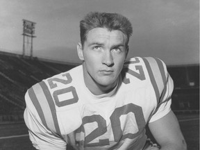 File-This 1958 file photo shows Billy Cannon (20), Louisiana State University halfback.  Cannon, the gifted running back who won the Heisman Trophy for LSU in 1959 with a memorable Halloween night punt return touchdown against Mississippi, died Sunday, May 20, 2018. He was 80. LSU said Cannon, the school's only Heisman winner, died at his home in St. Francisville, La. The cause of death was not immediately known