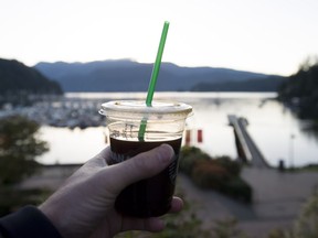 A plastic straw is pictured in a take away coffee cup in Deep Cove in North Vancouver, B.C., Friday, May, 11, 2018.