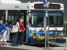 Transit users at Surrey Central bus loop and Skytrain station.
