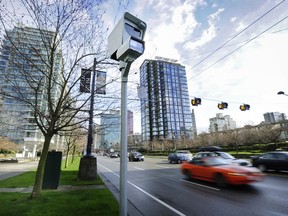 At the ready, red-light cameras are set up to catch drivers heading west on Georgia Street after crossing Denman Street in Vancouver in March 2012.