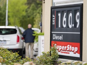 SURREY,BC:APRIL 30, 2018 -- A motorist fills up his car at 160.9 a litre, the posted price for regular gas in Surrey, BC, April, 30, 2018. (Richard Lam/PNG) (For ) 00053164A [PNG Merlin Archive]