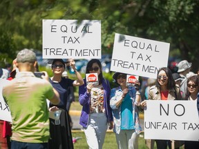 Protesters rally against the school tax on homes valued over $3 million, outside Jericho Gym in Vancouver on May 27, 2018.