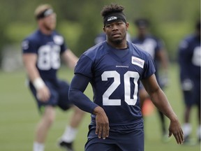 Seattle Seahawks running back Rashaad Penny takes part in a drill on May 4, 2018, during NFL rookie football camp in Renton, Wash.