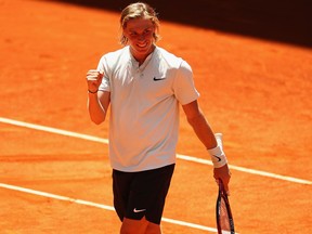 Denis Shapovalov of Canada celebrates to the crowd after defeating Benoit Paire of France at the Mutua Madrid Open tennis tournament on May 8, 2018