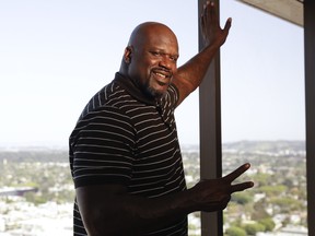 Shaquille O'Neal poses for a picture in Los Angeles on April 13, 2018. The basketball icon-turned-TV personality is adding poetry to his resume as one of the stars of the new public television series Poetry in America. (AP Photo/Chris Carlson)