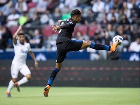 San Jose Earthquakes' Danny Hoesen knocks the ball out of the air with his foot and scores a goal against the Vancouver Whitecaps during first half MLS soccer action in Vancouver, B.C., on Wednesday May 16, 2018.
