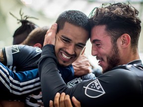 Cristian Techera, left, and Russell Teibert celebrate Techera's second of three goals in the Whitecaps' 3-3 draw with the New England Revolution on Saturday at B.C. Place.