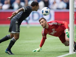 Vancouver Whitecaps' Cristian Techera, left, scores his second goal against New England Revolution goalkeeper Matt Turner during the second half of last Saturdays MLS game at B.C. Place. Techera had a hat trick on the evening, but it was defensive missteps that cost the home side in a 3-3 tie.