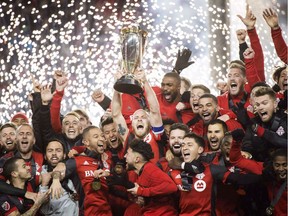 They say money can't buy champions, but in Major League Soccer it can make you a contender. The big-spending Toronto FC hoists the MLS Cup last year after defeating the Seattle Sounders in the final.