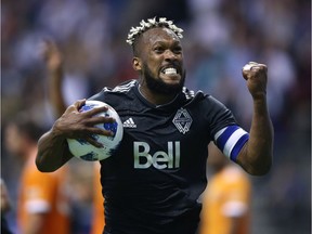 Vancouver Whitecaps defender Kendall Watson (4) celebrates his goal against the Houston Dynamo during second half MLS soccer action in Vancouver on Friday May 11, 2018.
