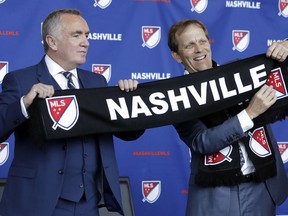 Ian Ayre, left, is introduced by John Ingram, right, the lead owner the Nashville, Tenn., MLS franchise, as the first chief executive officer of the team Monday, May 21, 2018, in Nashville. Ayre is a former CEO of the Liverpool Football Club of the English Premier League.