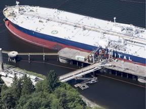 A aerial view of Kinder Morgan's Trans Mountain marine terminal filling a oil tanker in Burnaby, B.C., is shown on Tuesday, May 29, 2018.