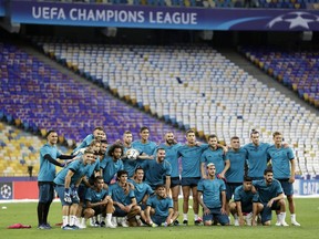 Real Madrid players pose for a photo during a Friday training session at the Olimpiyskiy Stadium in Kiev, Ukraine, ahead of Saturday's Champions League Final soccer match between Real Madrid and Liverpool.