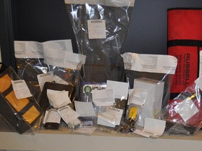 Cody Parent, a 26-year-old Surrey man, has been arrested after allegedly using stolen identification and credit card to purchase a new BMW. Shown are some of the items seized during a search of Parent's home.